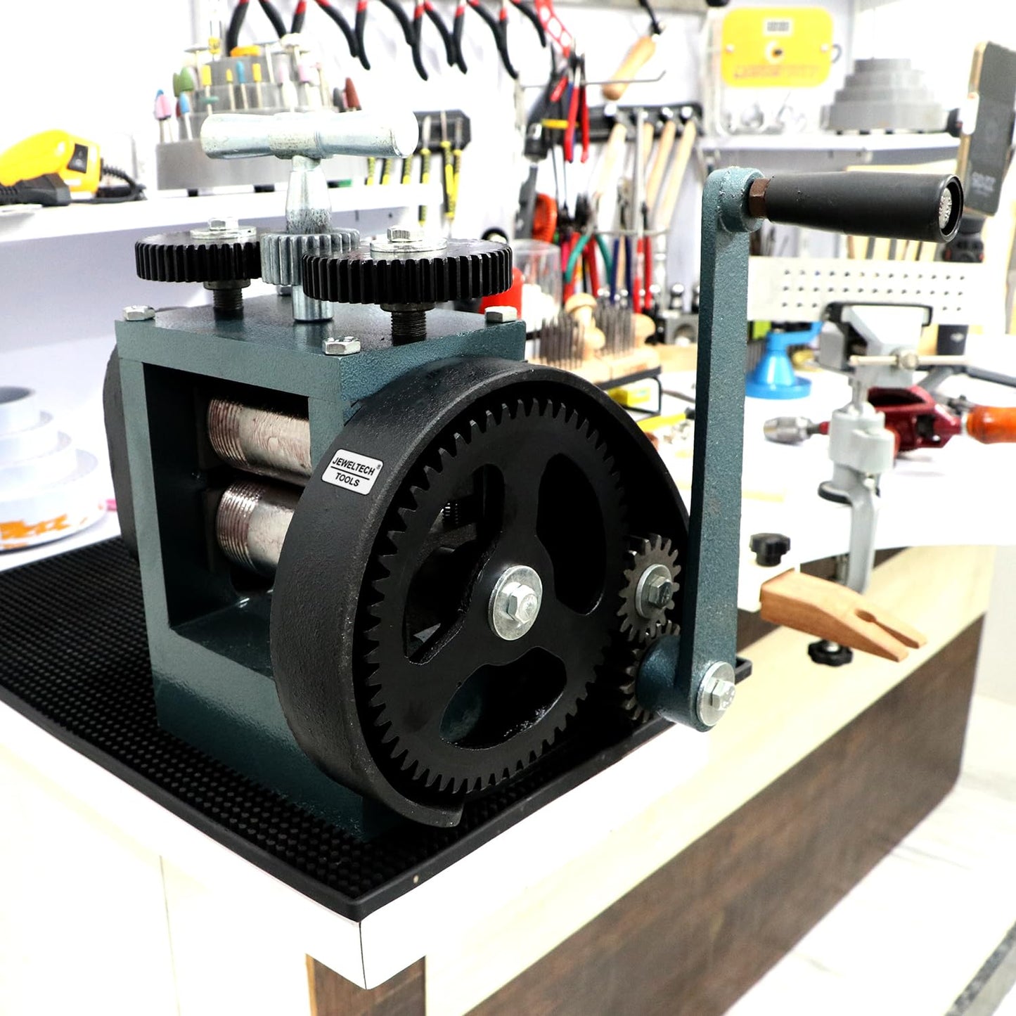 Jewellery Rolling Mill Machine 4 inch by Jeweltech placed on jeweler’s workshop table