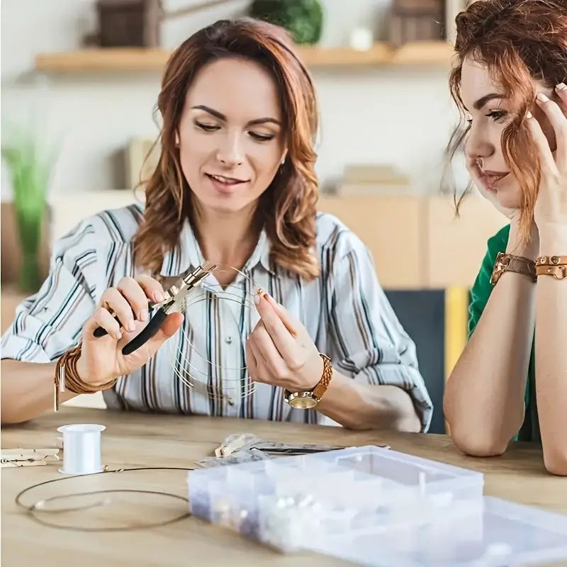Person using the nylon jaw pliers and round nose pliers for wire wrapping beads in jewelry making.