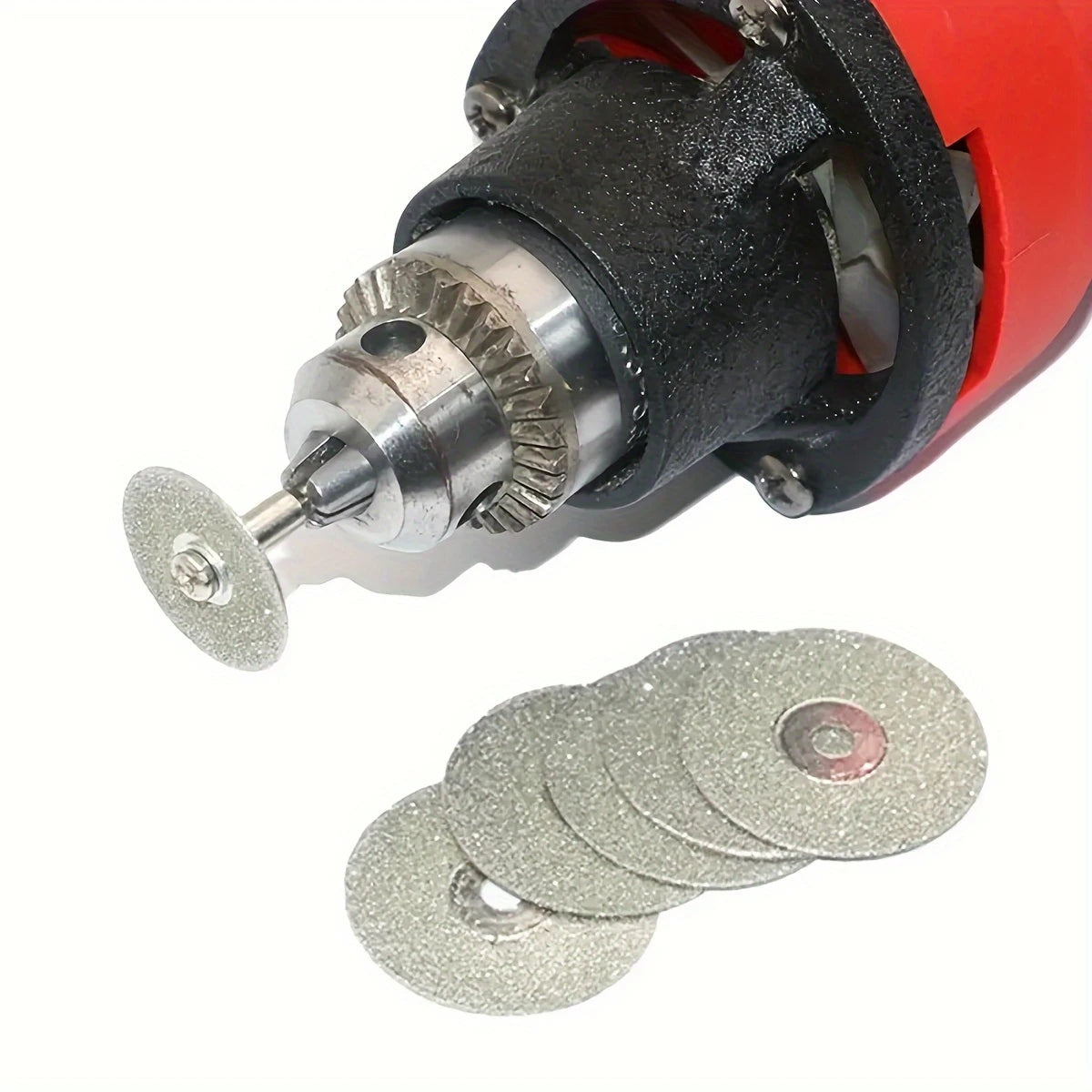 Rotary tool with mounted 25mm diamond cutting disc and spare wheels.