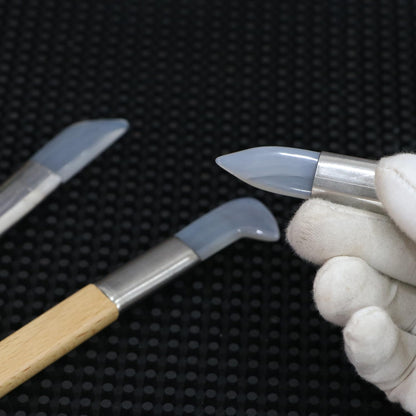 Close-up of jade burnisher tip for goldsmith jewellery polishing