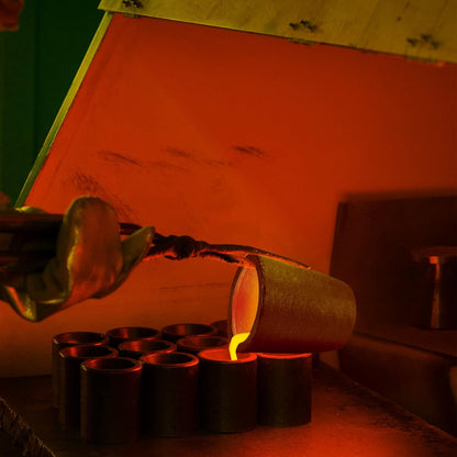 Industrial crucible pouring molten metal inside a furnace, demonstrating safe handling and high-temperature operation.