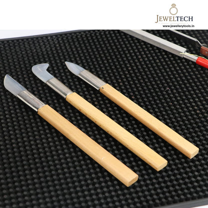 Jewellery jade burnisher set on workbench with tools