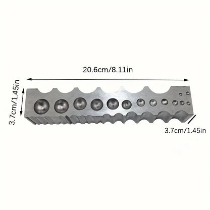Metal doming block dimensions: 20.6 cm x 3.7 cm, with multiple sizes of round depressions for shaping rings