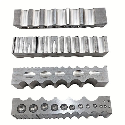 Set of steel doming blocks with various groove profiles and cavity shapes for jewelry metal forming