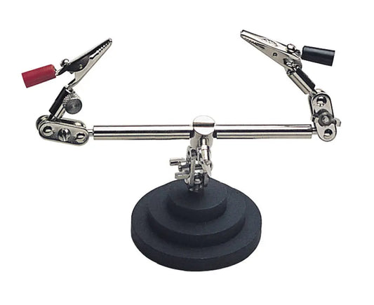 Adjustable helping hand soldering tool with two alligator clips mounted on a heavy round base for jewelry or precision work


